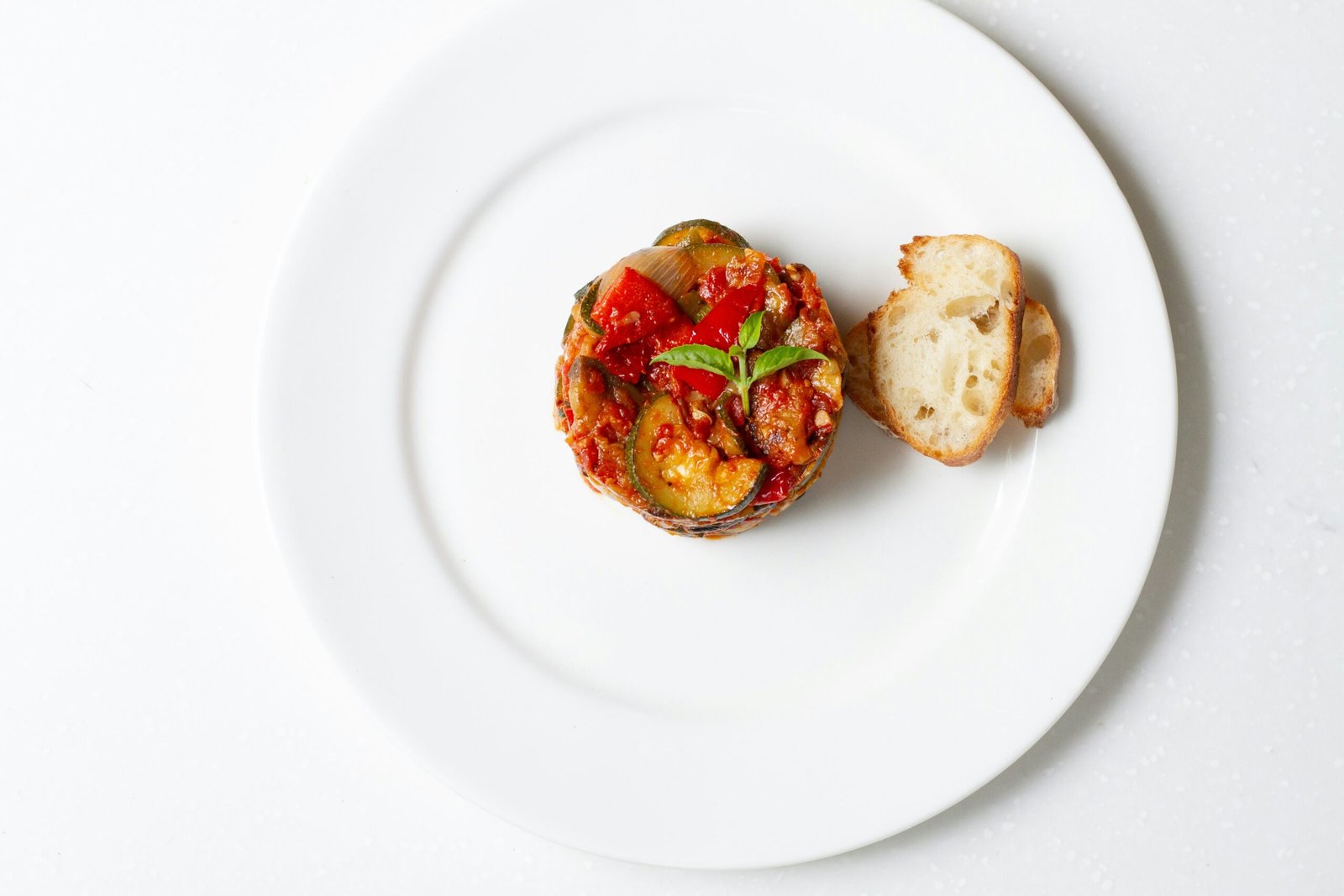 a white plate topped with a piece of bread