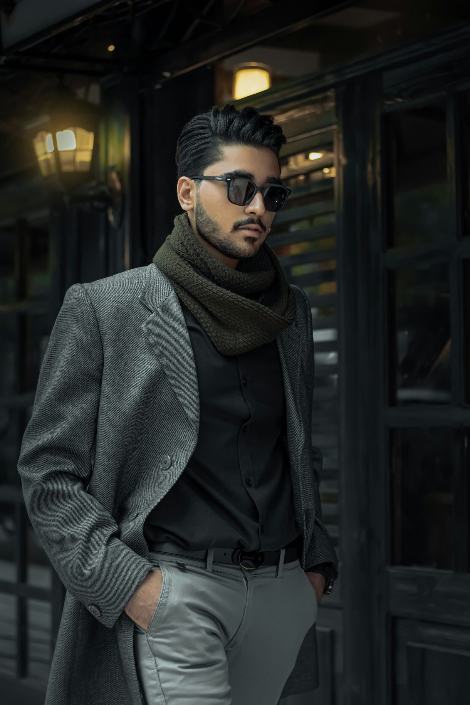 man in gray coat wearing black sunglasses